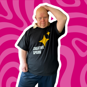 person wearing a creative spark tshirt