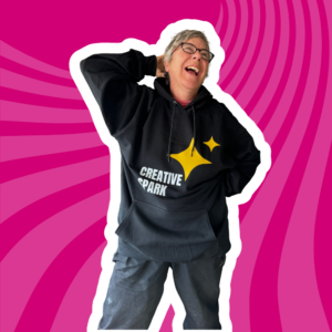 person wearing a creative spark sweat shirt