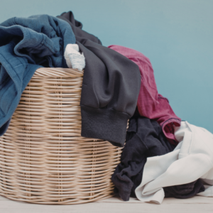 wicker hamper with clothes spilling out