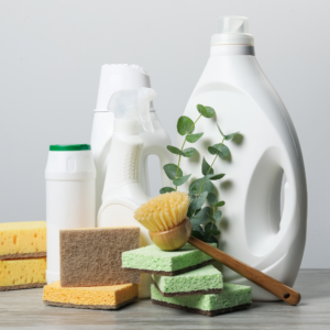 white bottles of cleaning products, sponges, brushes for cleaning